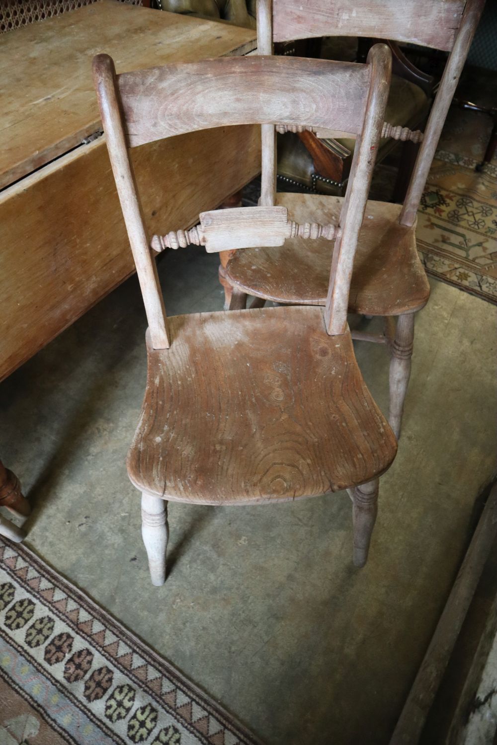 A Victorian pine Pembroke table, width 98cm and three Victorian Windsor chairs